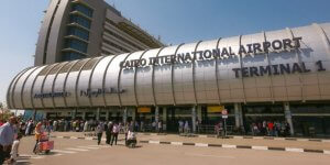 Holidaymakers outside Cairo International Airport Terminal 1.