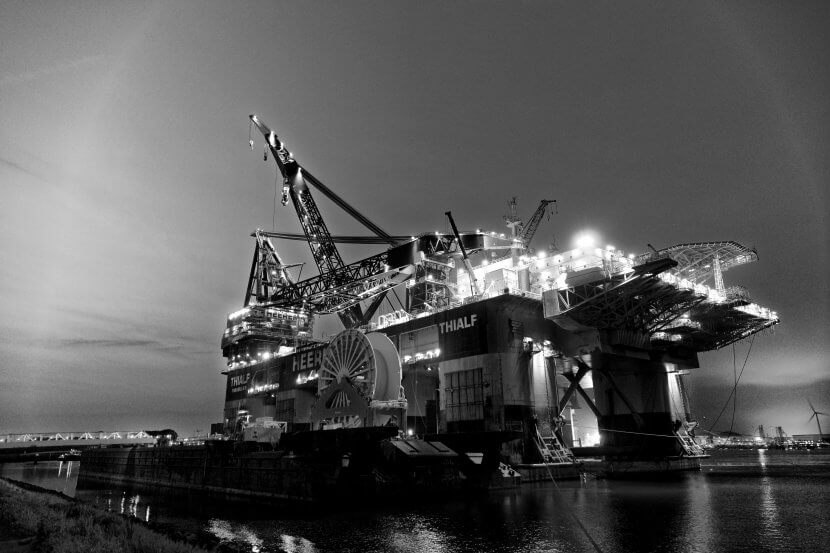 Monochrome oil platform in dock.