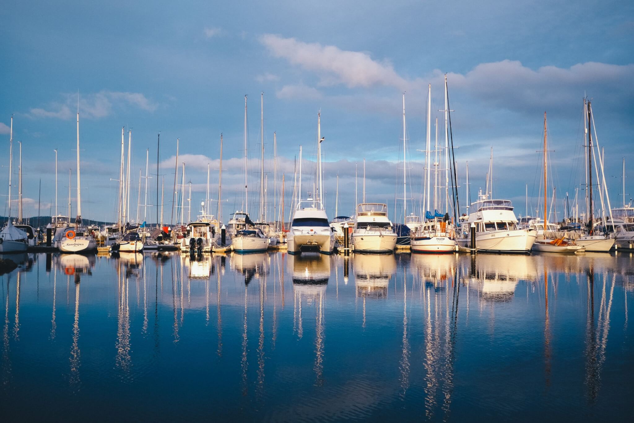 Pleasure craft boats on the water in a marina.